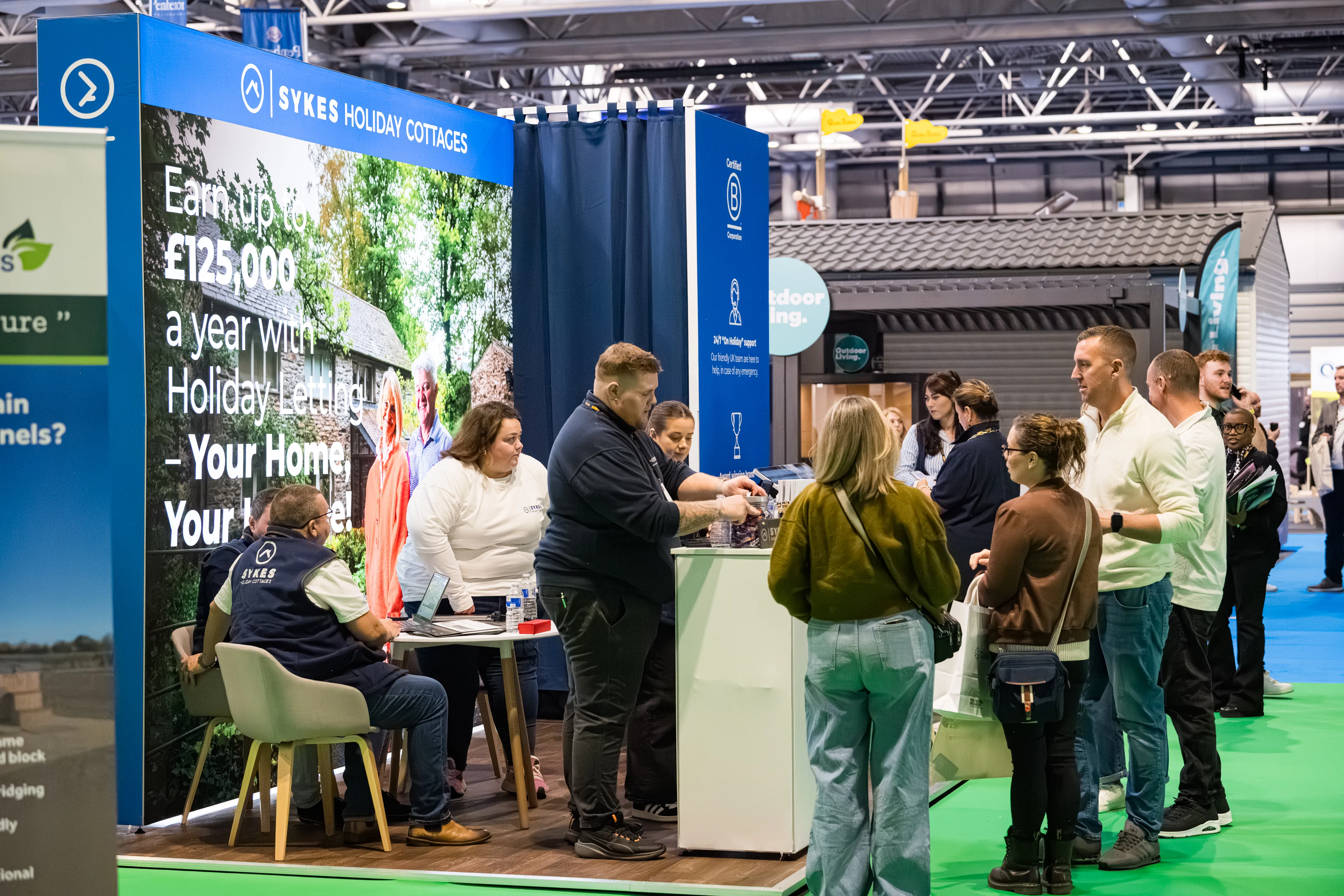 A group of people at an exhibition stand.